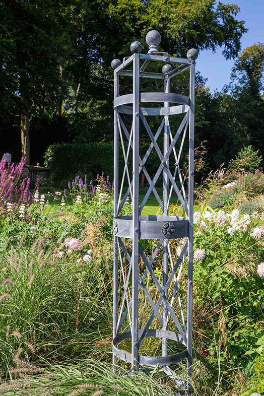 An Arthur Jack steel garden obelisk provides sturdy support for your climbers